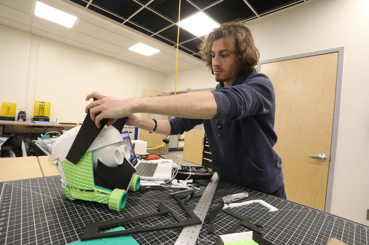 Zane Devlin building the Consuming Trooper helmet in the fabrication lab